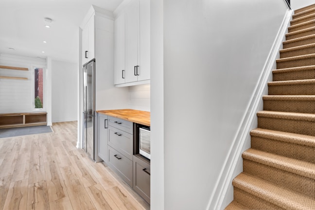 a kitchen with white cabinets