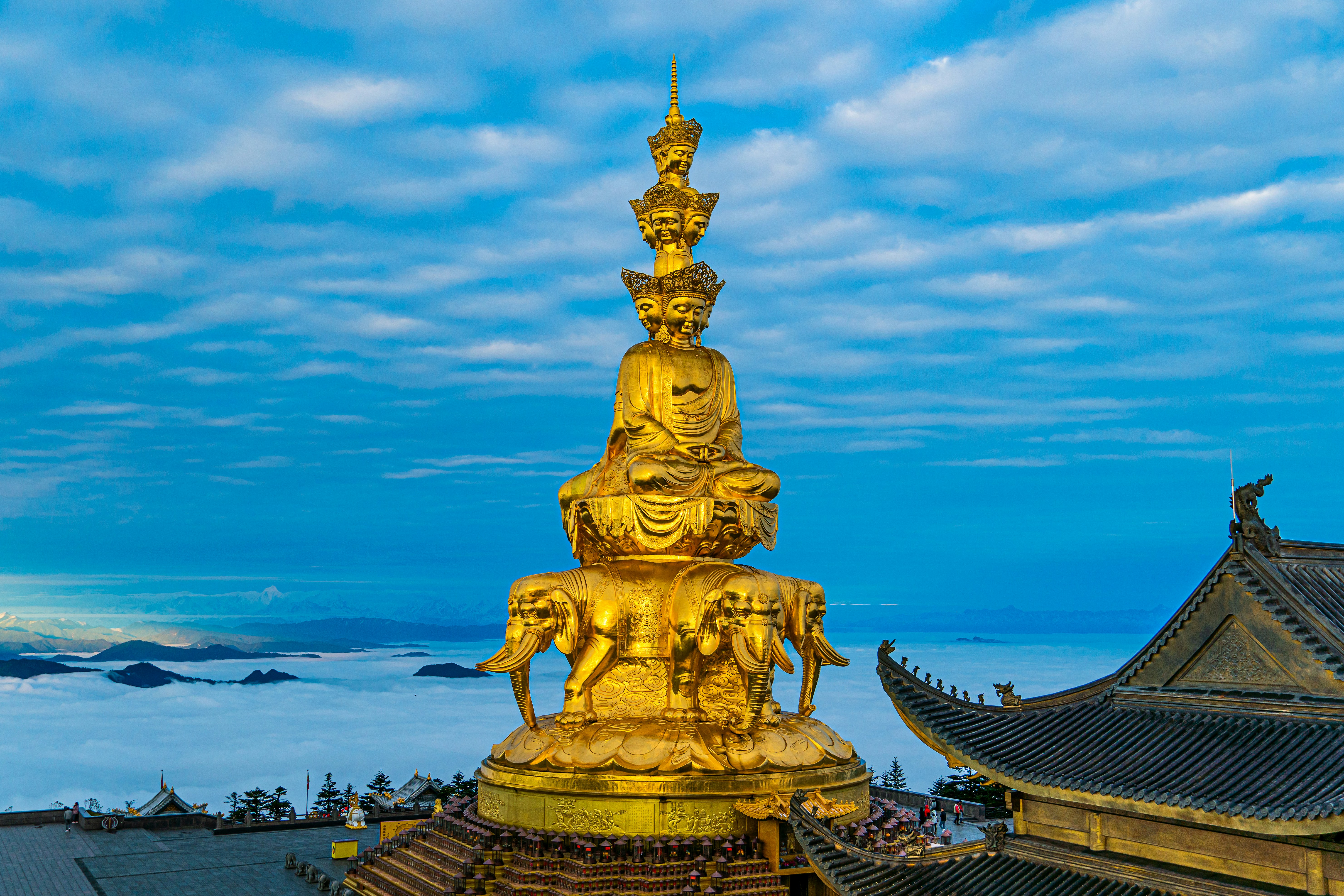 a golden statue on a building