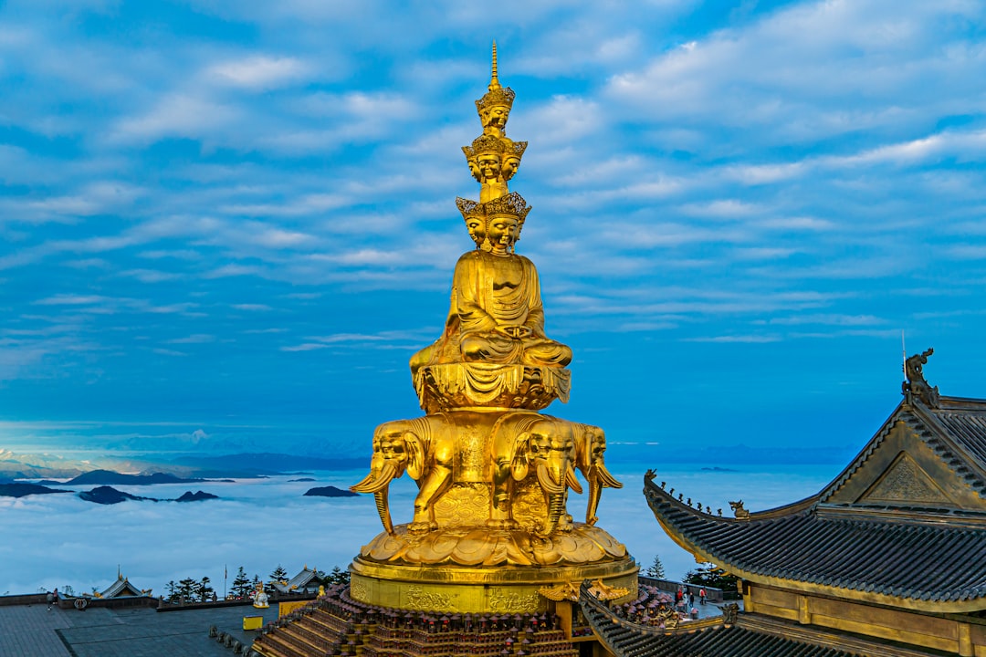 Mount Emei golden summit with Buddha statue in mountain setting