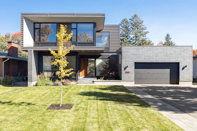 a house with a tree in the front yard