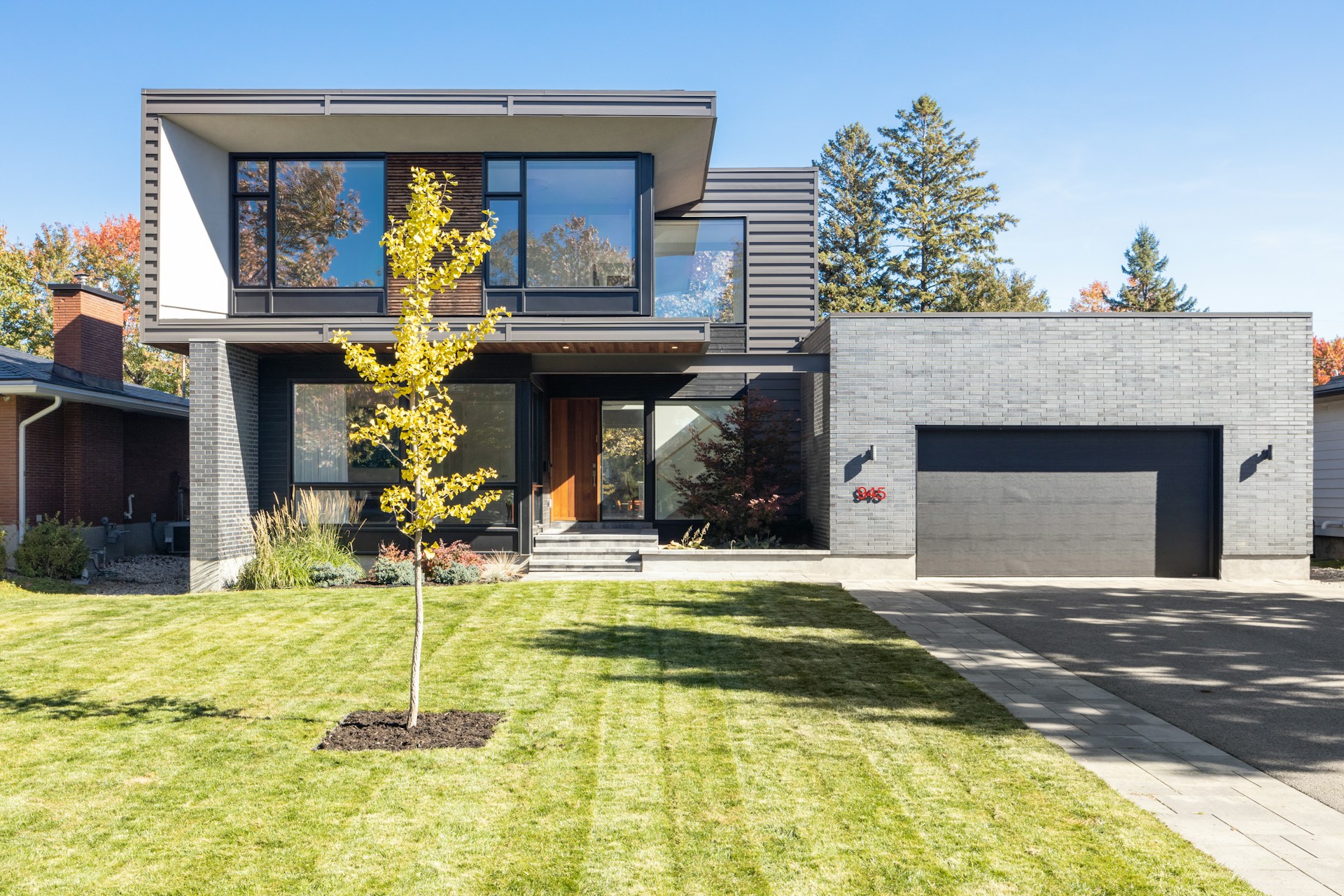a house with a tree in the front yard