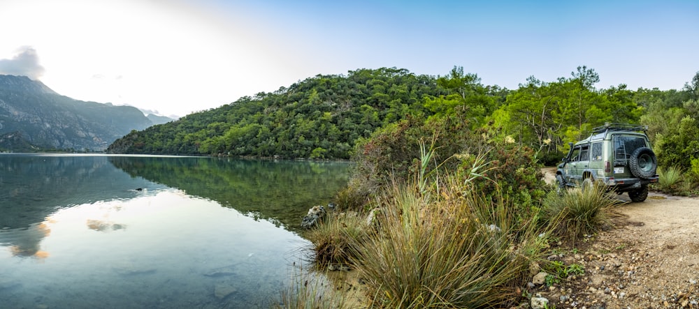 a van parked by a lake