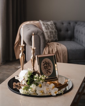 a table with a plate of food and candles on it