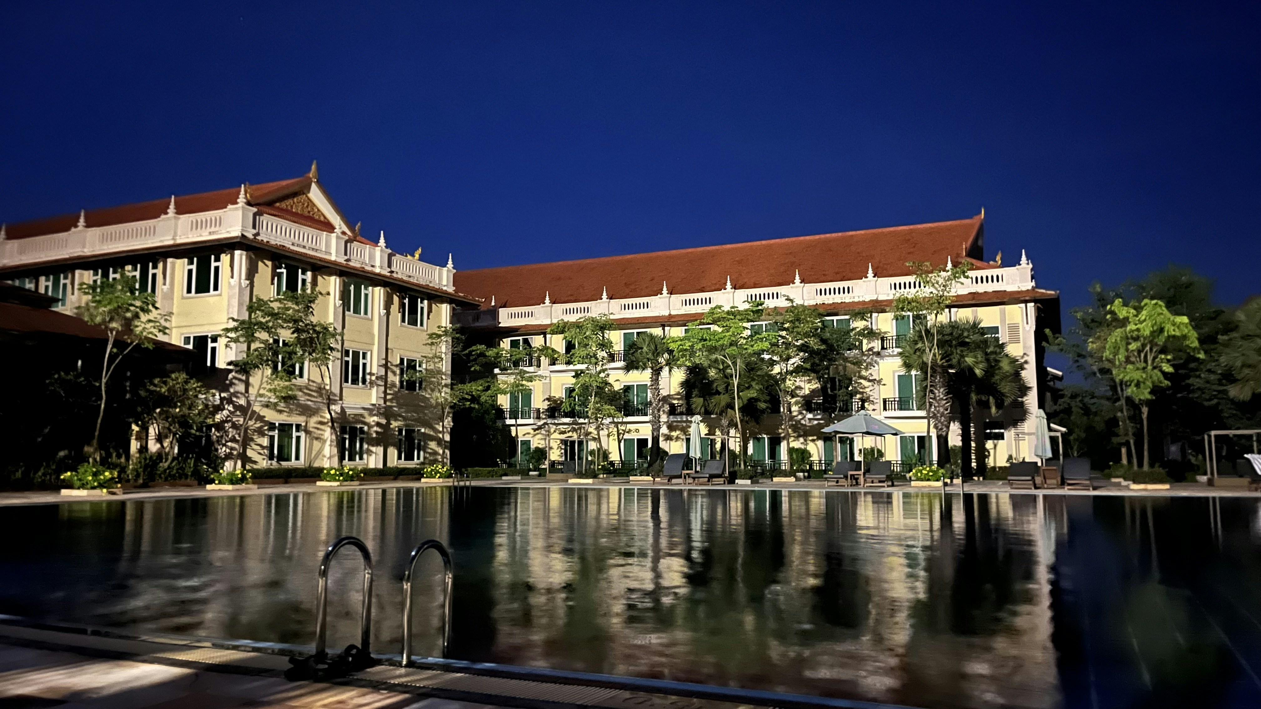 a building with a pool in front of it