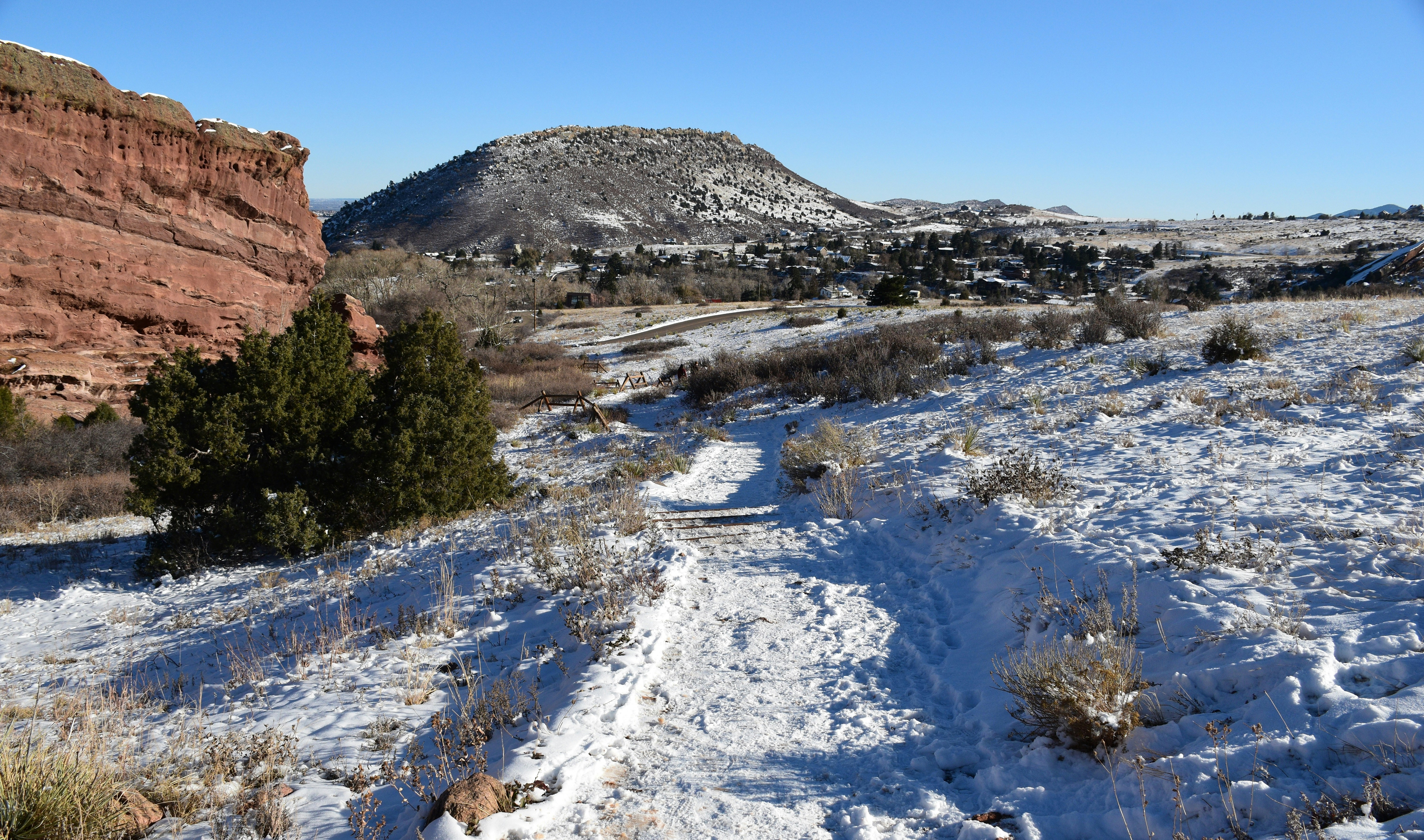 a snowy landscape with a mountain in the background