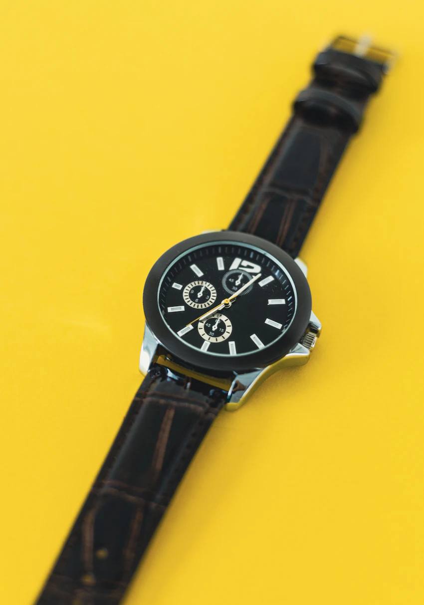 Dark wristwatch in an editorial photograph