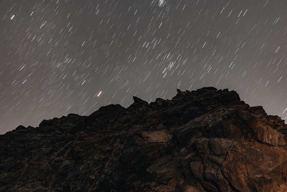 a mountain with stars in the sky