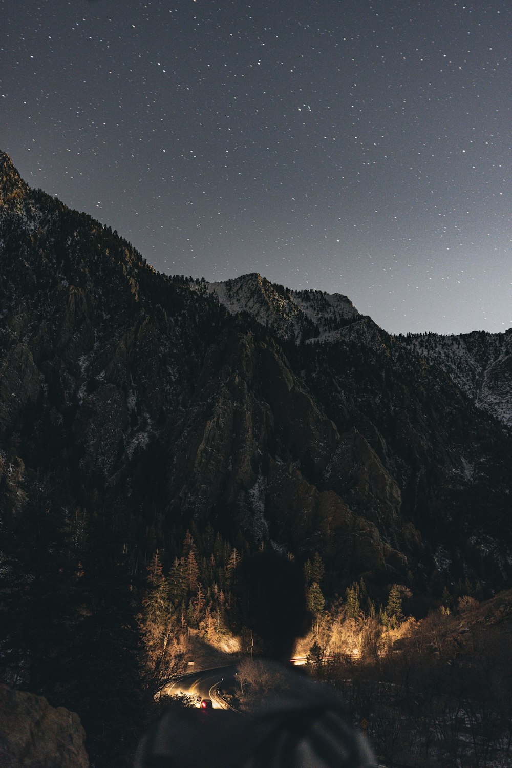 a mountain with a lake below