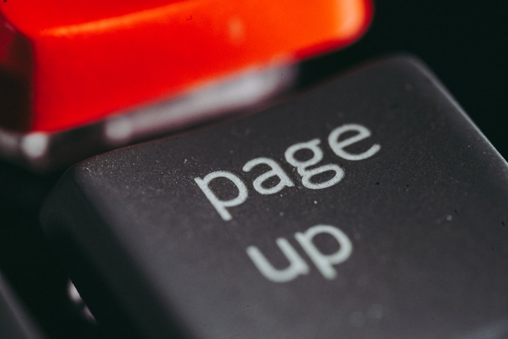 a close up of a black and red sign