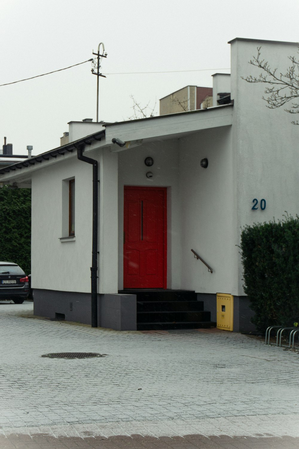 a white building with a red door