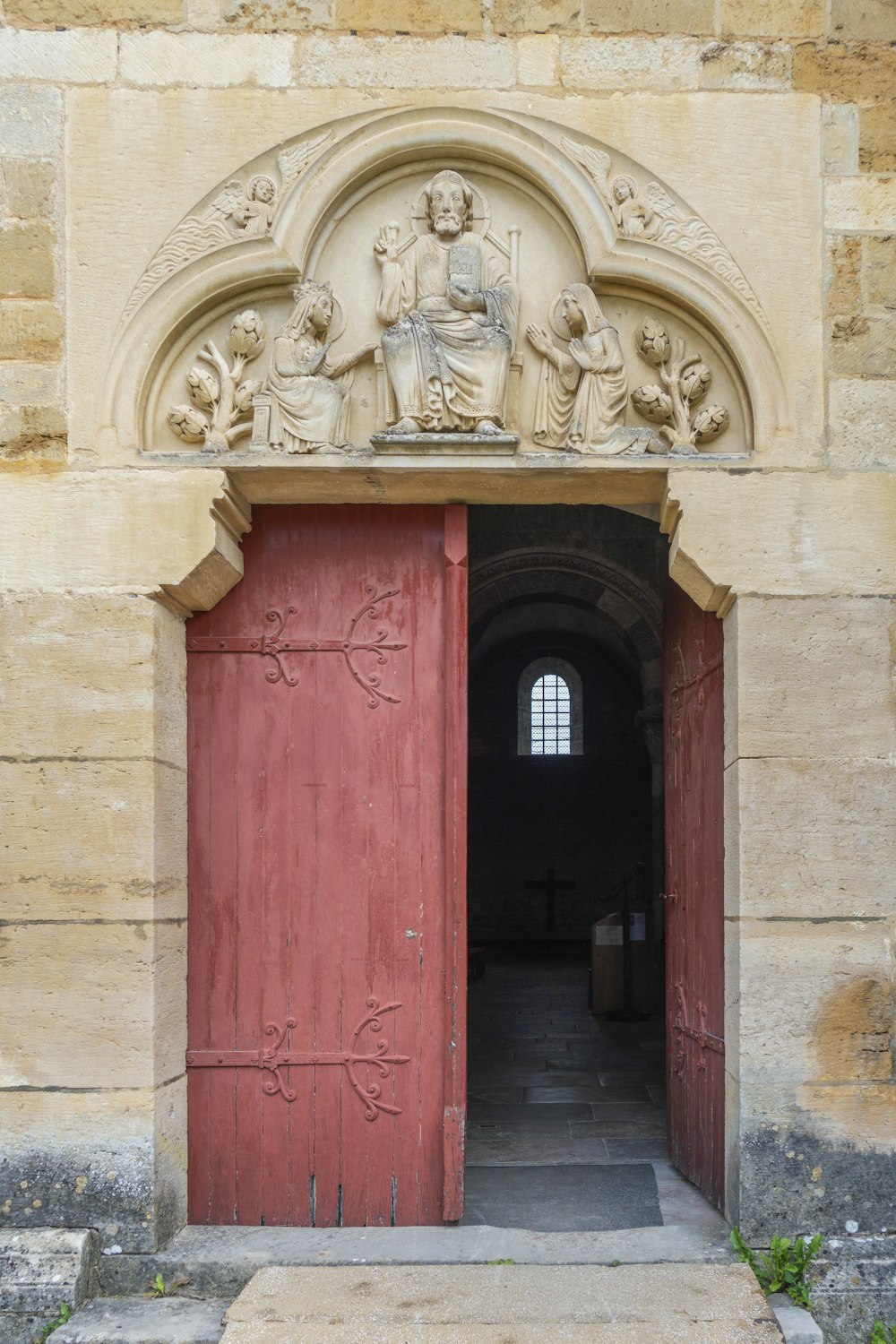 a door with statues on it