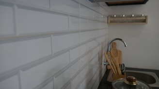 a kitchen with white tiles