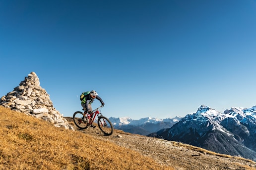 a person riding a bike on a mountain