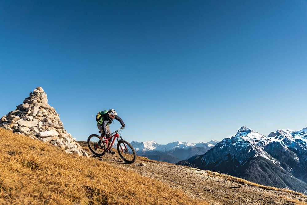 a person riding a bike on a mountain