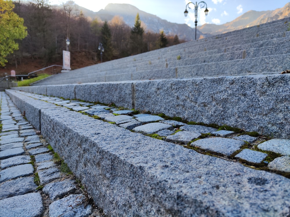 a stone wall with a stone walkway