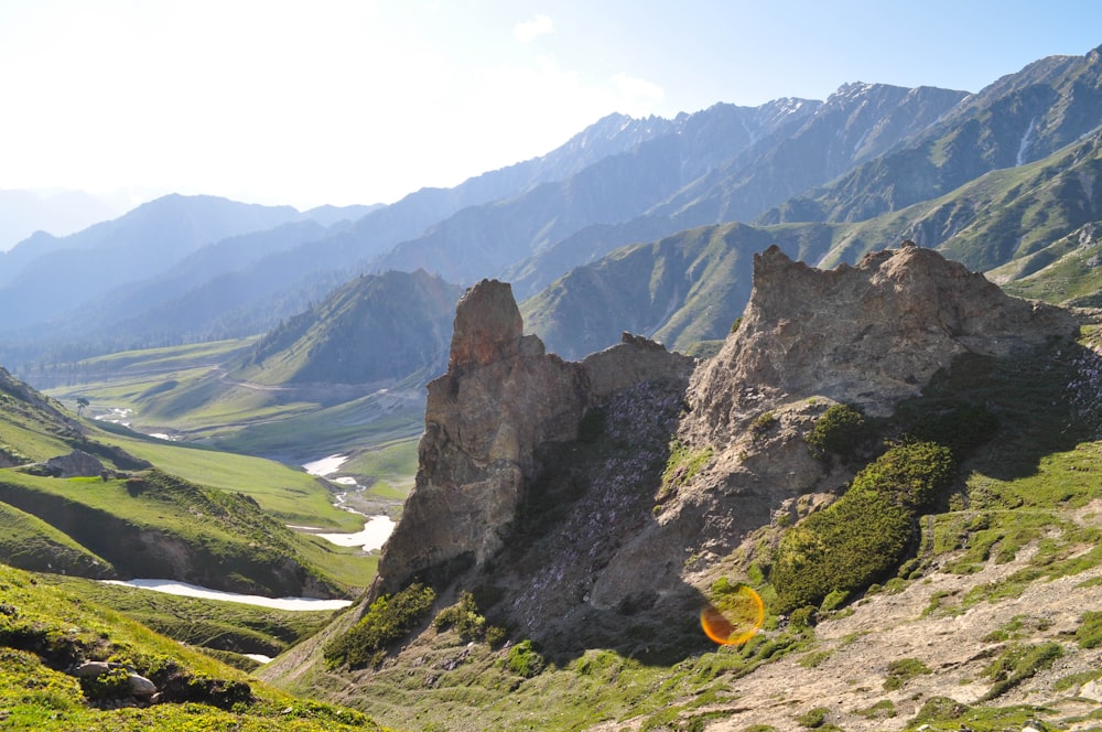 a rocky mountain with a river running through it