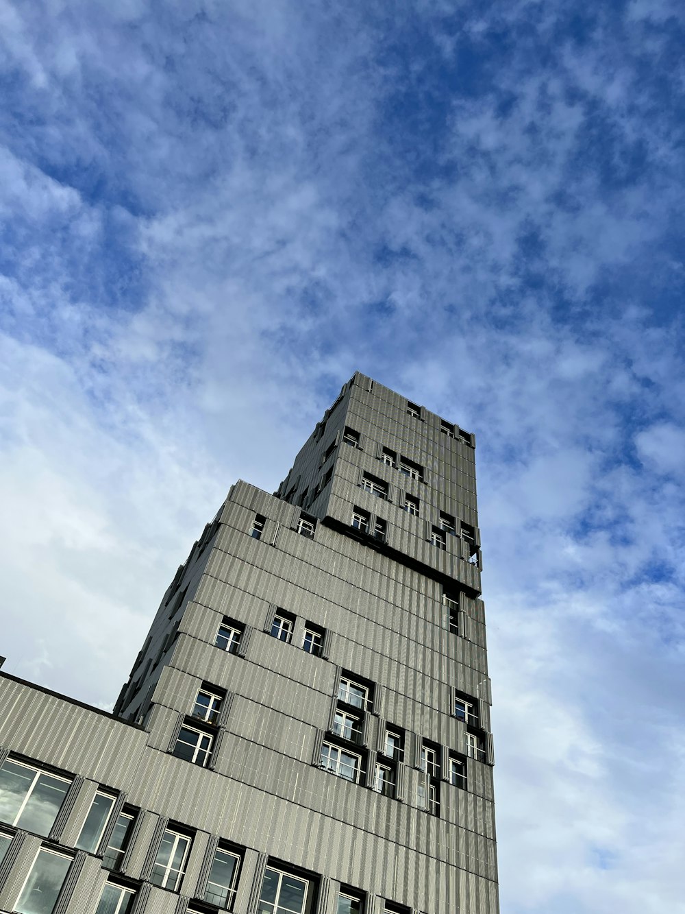 a tall building with a blue sky