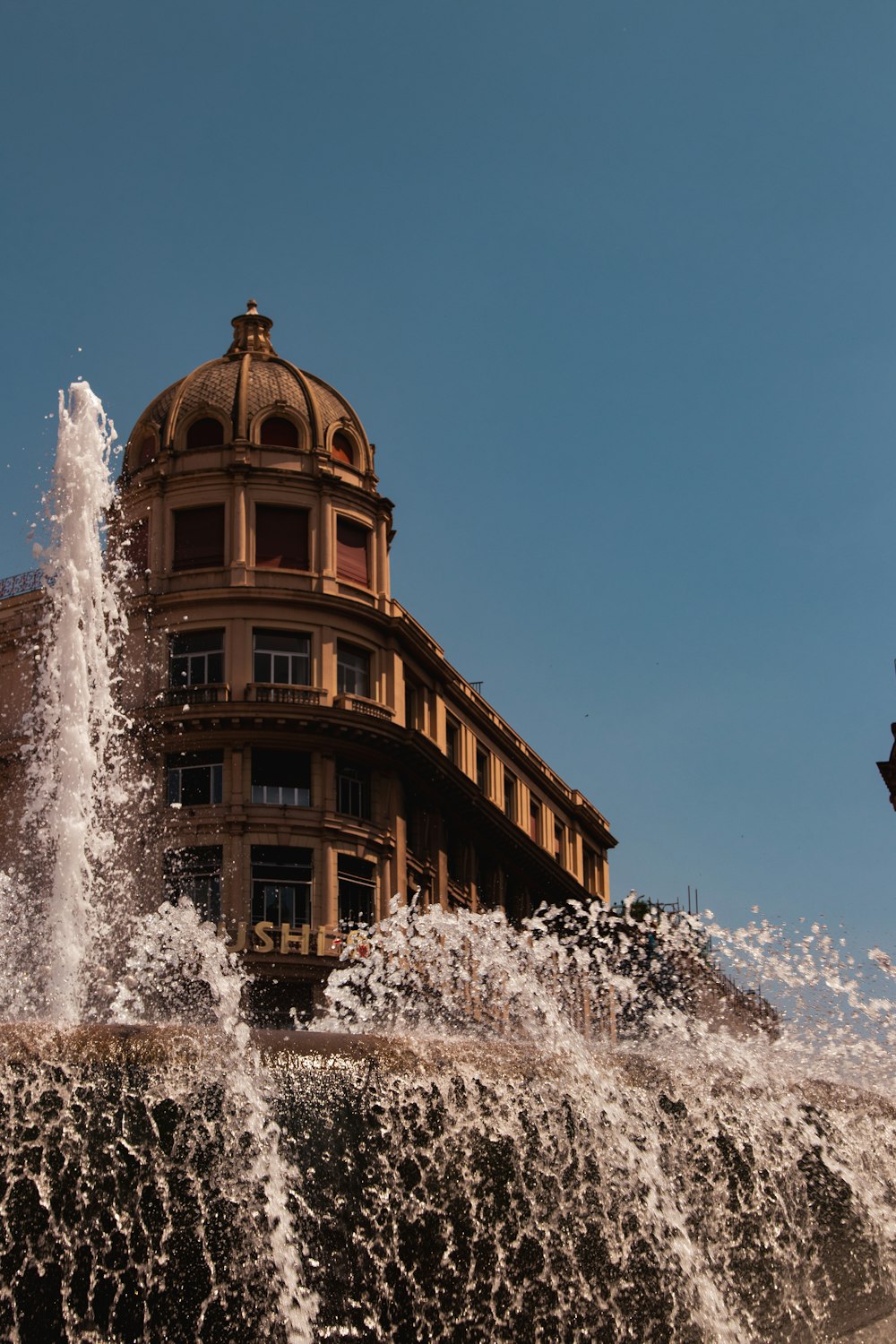 a building with a fountain in front of it