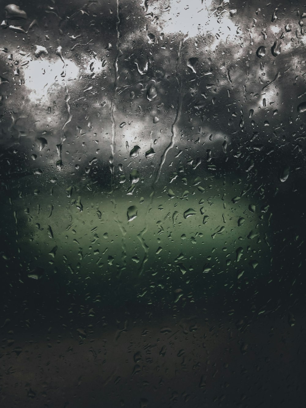 a wet window with rain drops on it