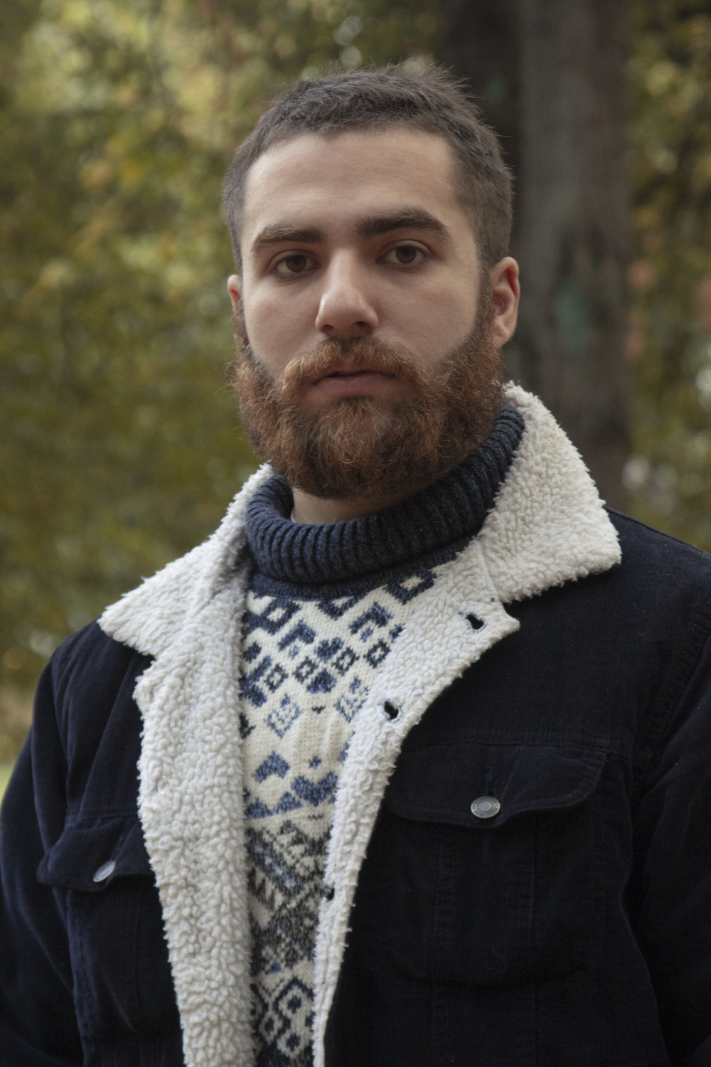 a man with a beard and scarf