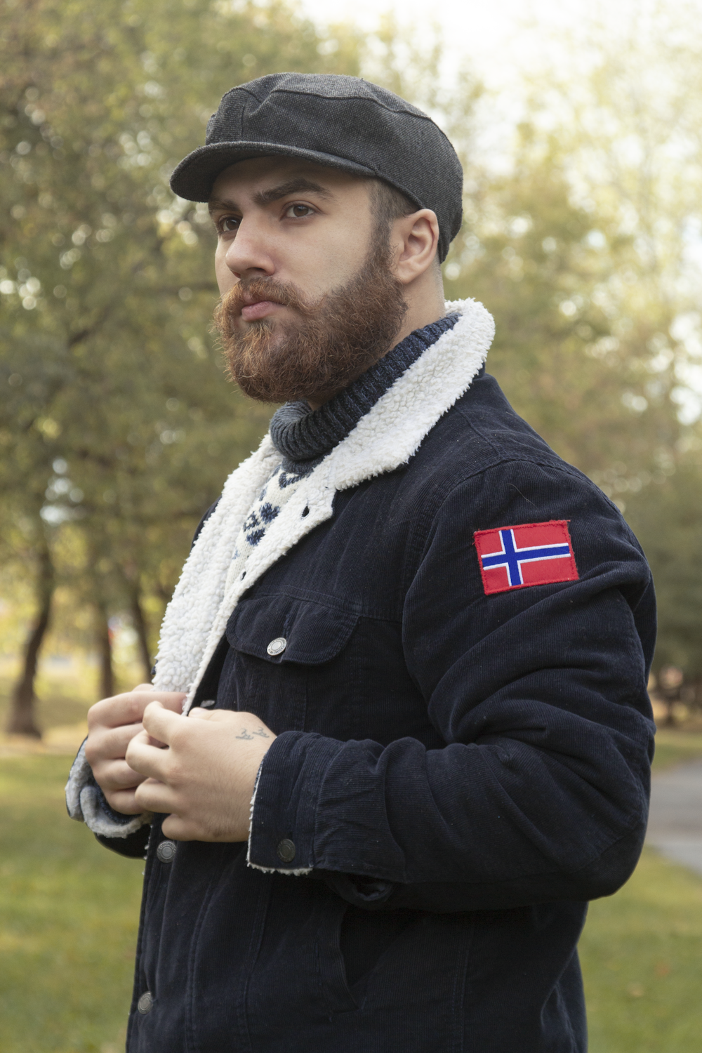 a man in a hat holding a flag