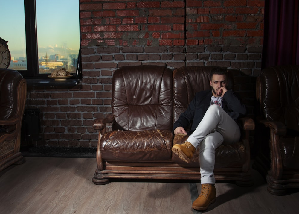 a person sitting on a leather chair