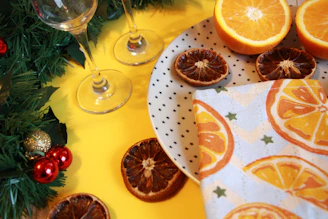Close-up of a festive table with plates of homemade Spanish dishes and glasses of wine.