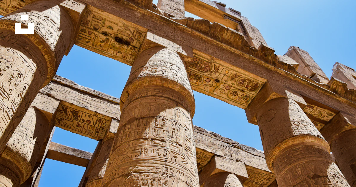 A building with columns and a sign photo – Free Luxor Image on Unsplash