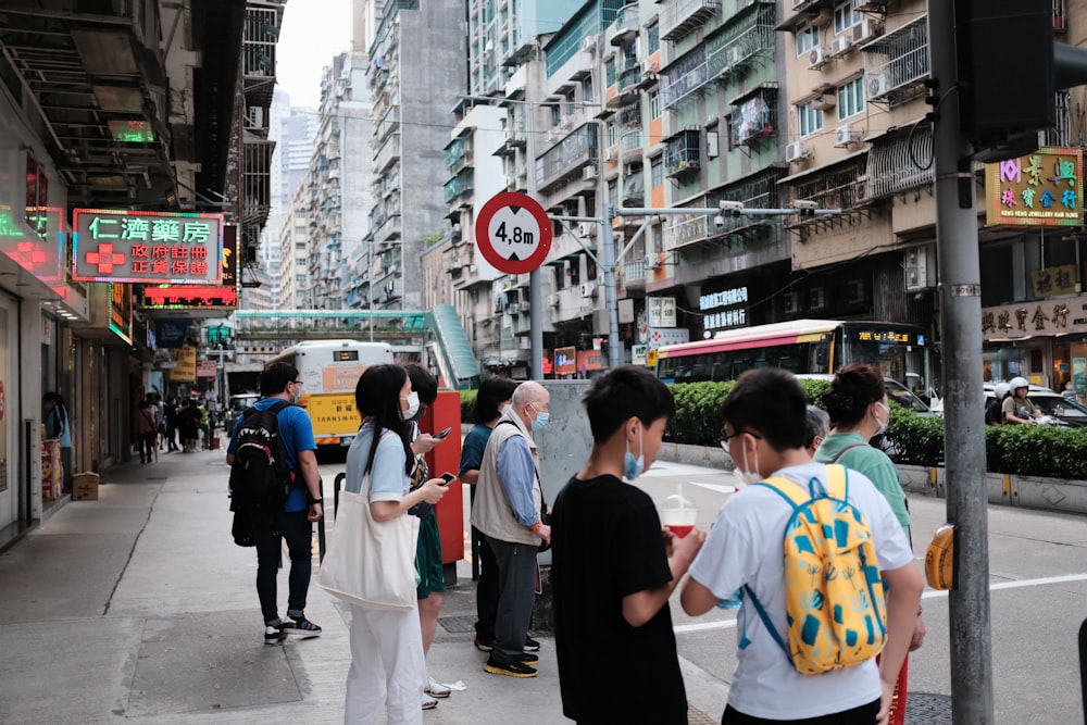 people standing on the sidewalk