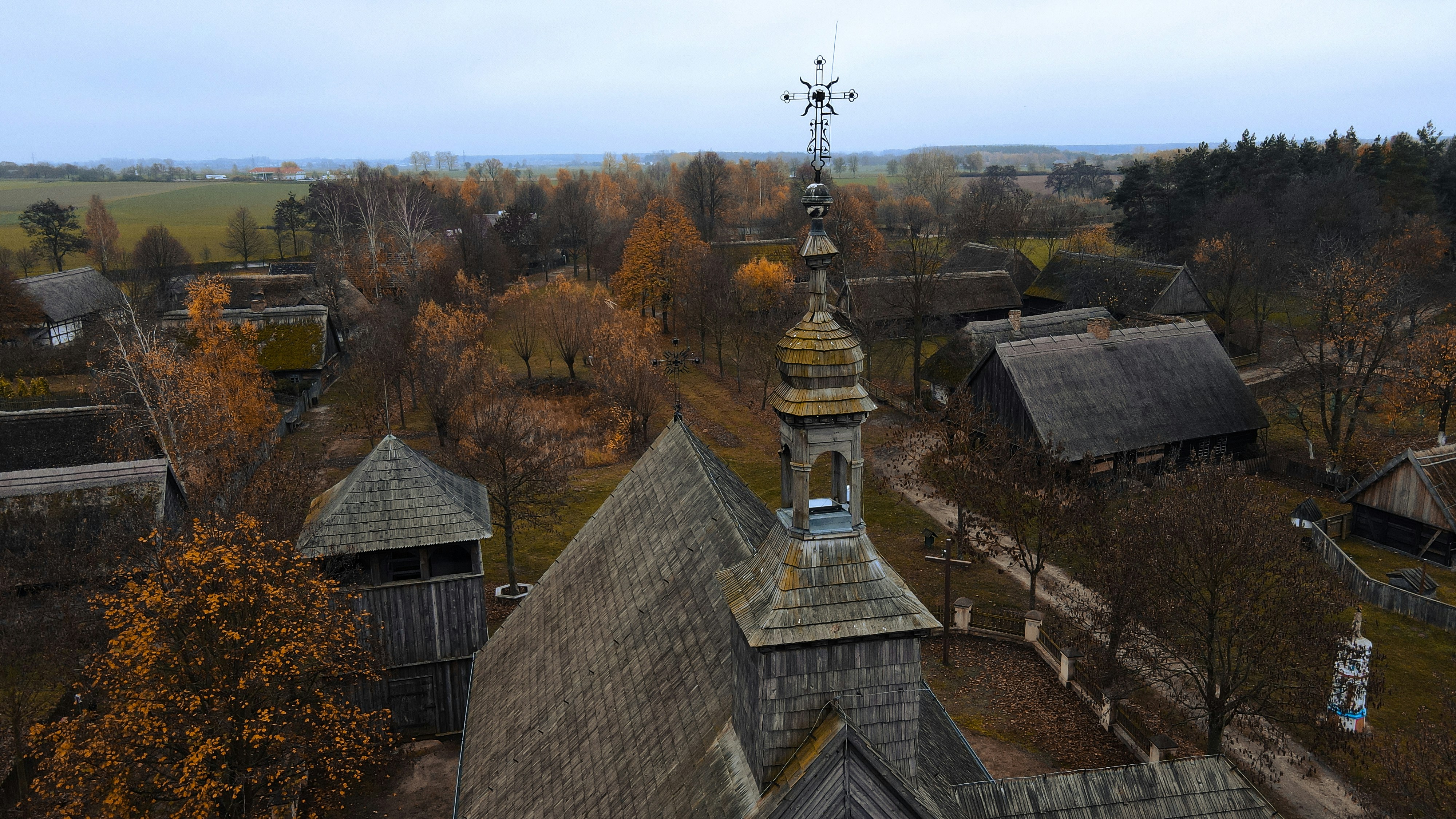 a group of buildings with trees in the back