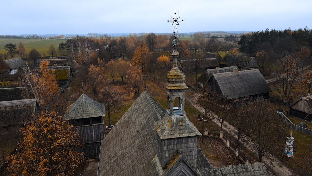 a group of buildings with trees in the back