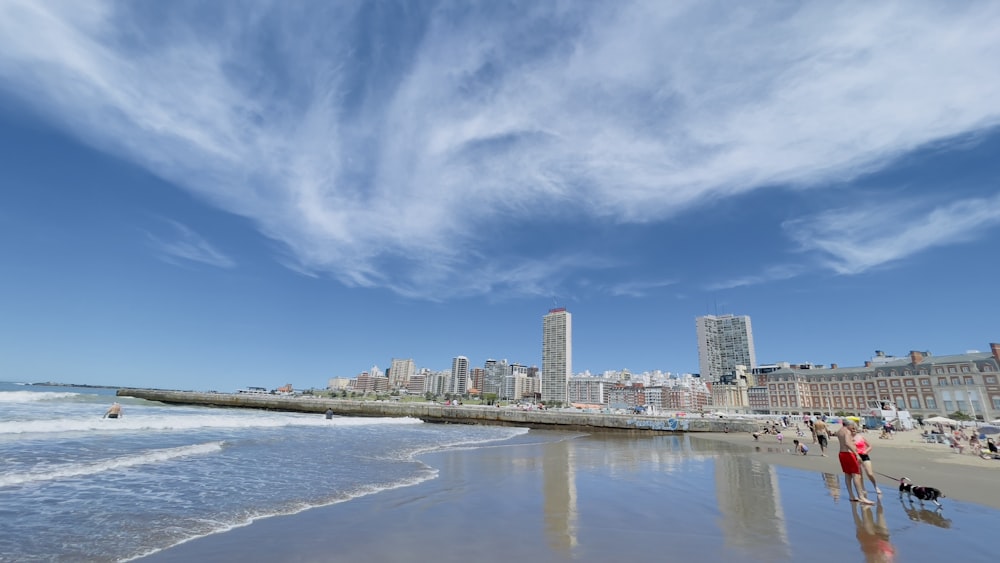 a beach with buildings in the background