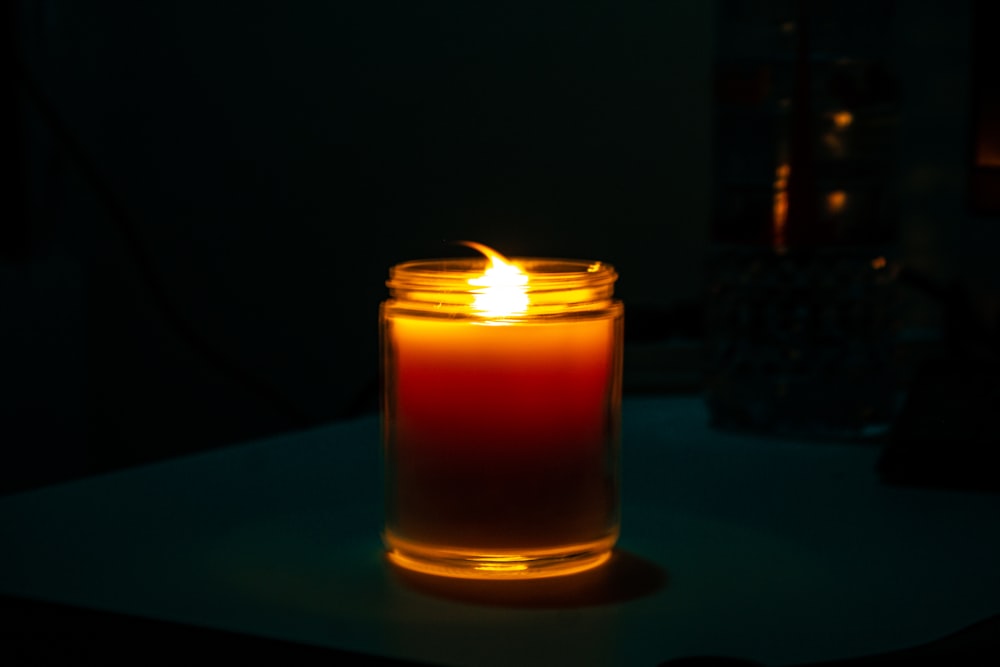 a candle in a glass