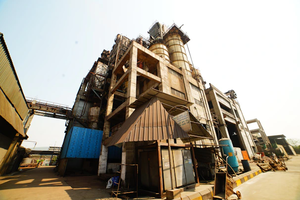 A panoramic shot of a large industrial facility with various sections freshly coated in protective paint.