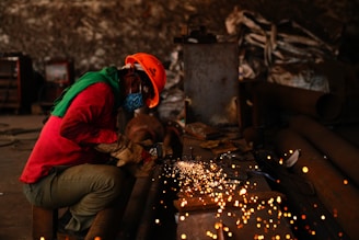 a person using a machine to cut fire