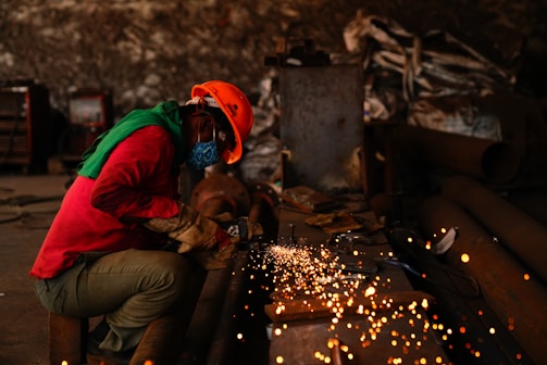 a person using a machine to cut fire