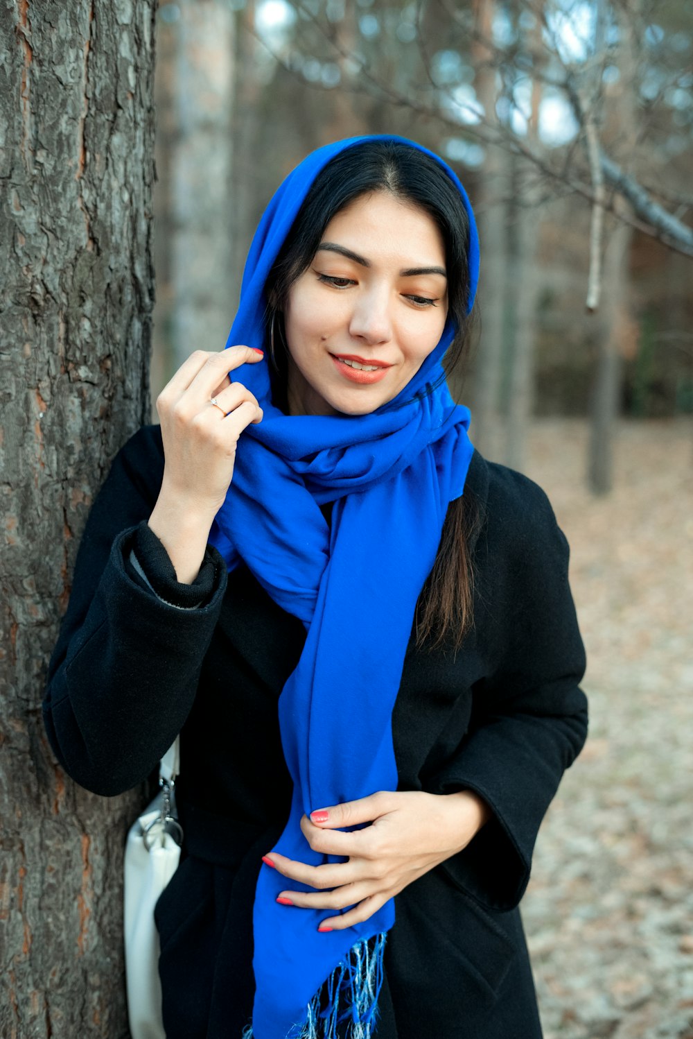 a person wearing a scarf and a scarf around the head