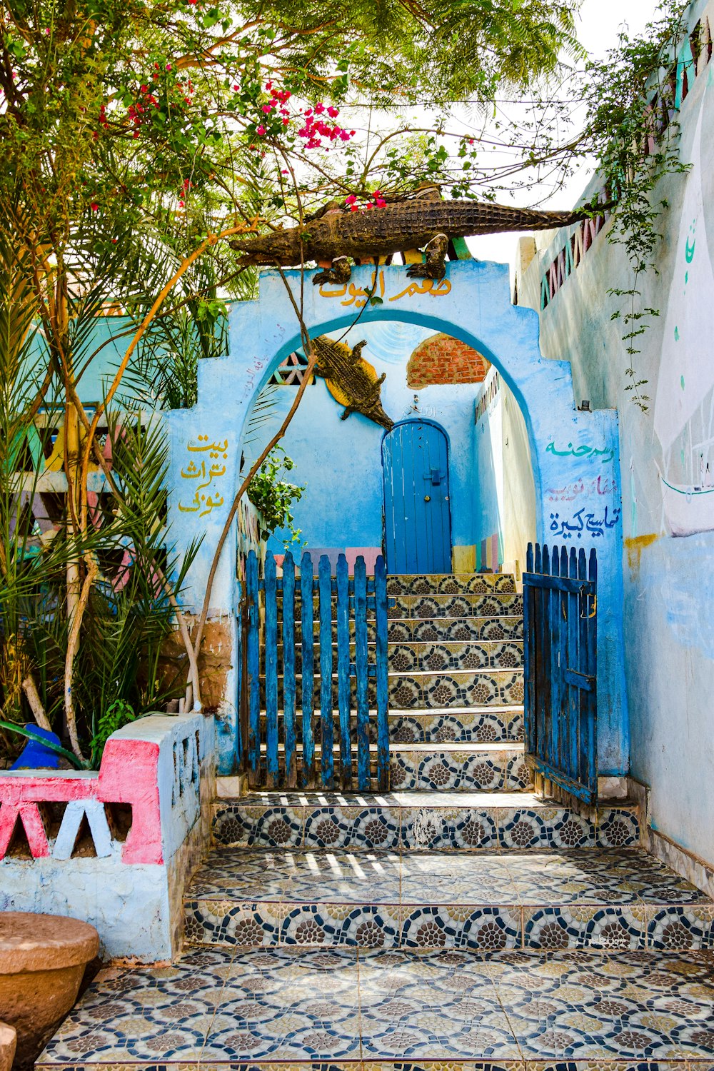 a blue gate with a gold dragon on it