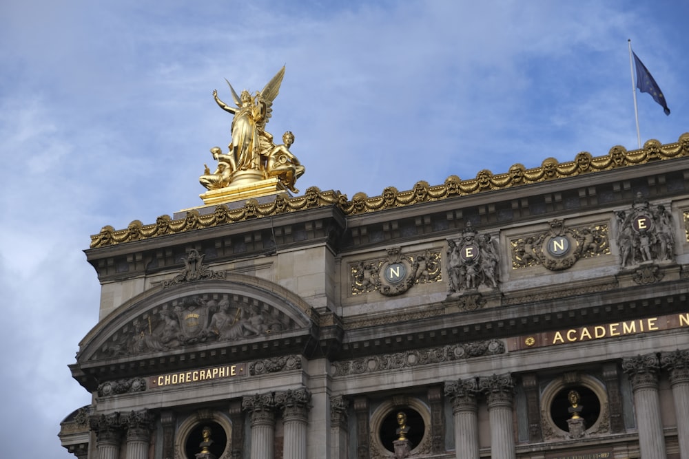 a building with a statue on top