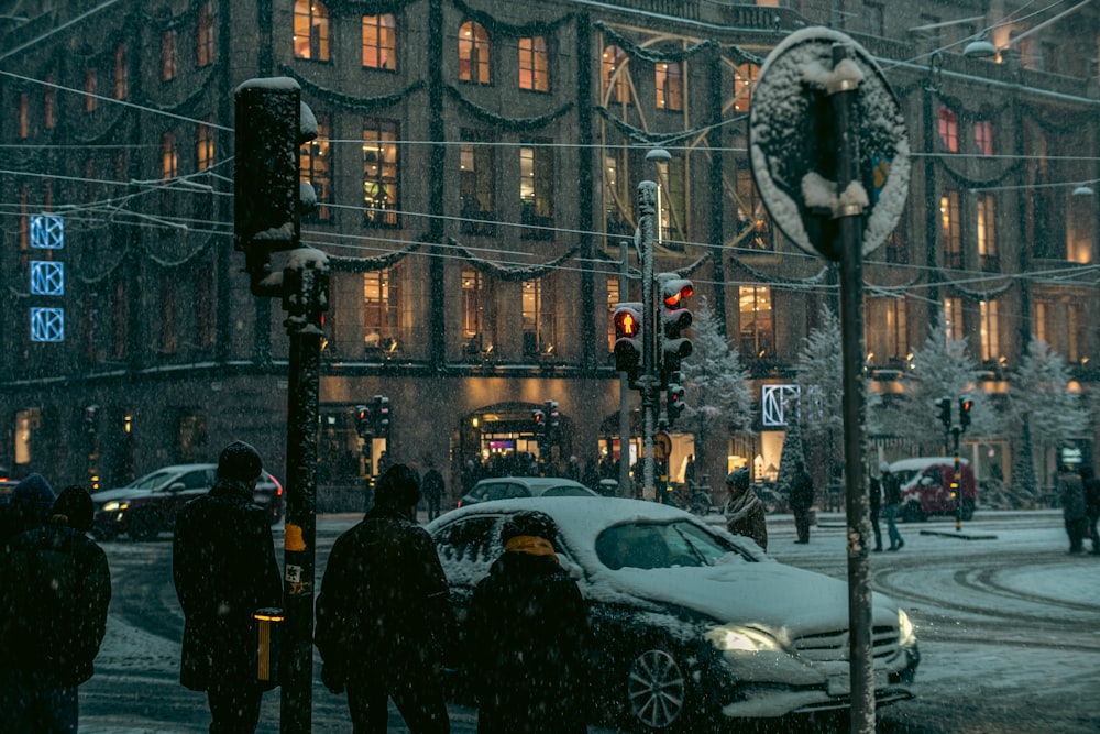 a group of people stand near each other on a street corner