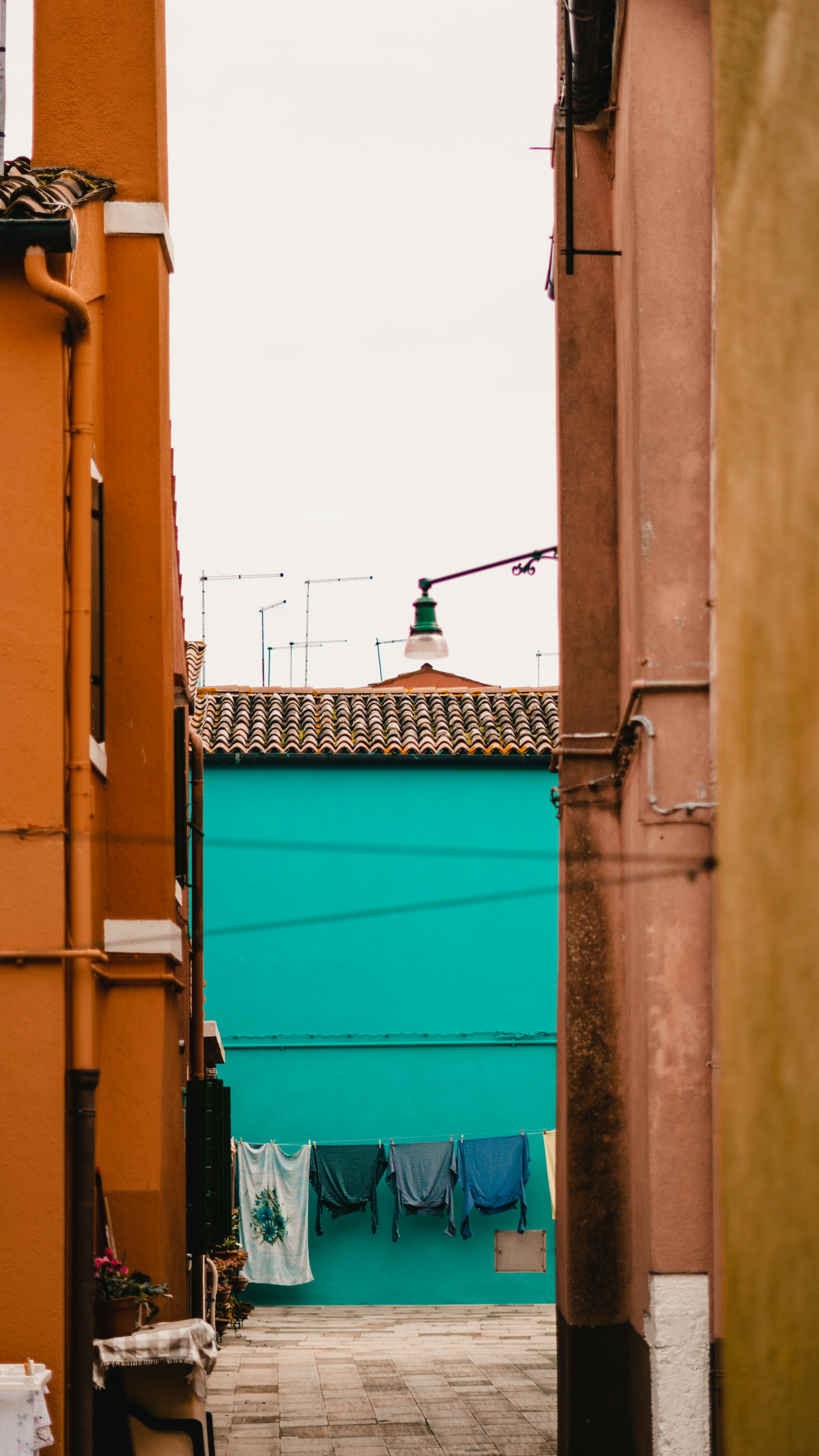 a door with a green door and a blue door with a green light