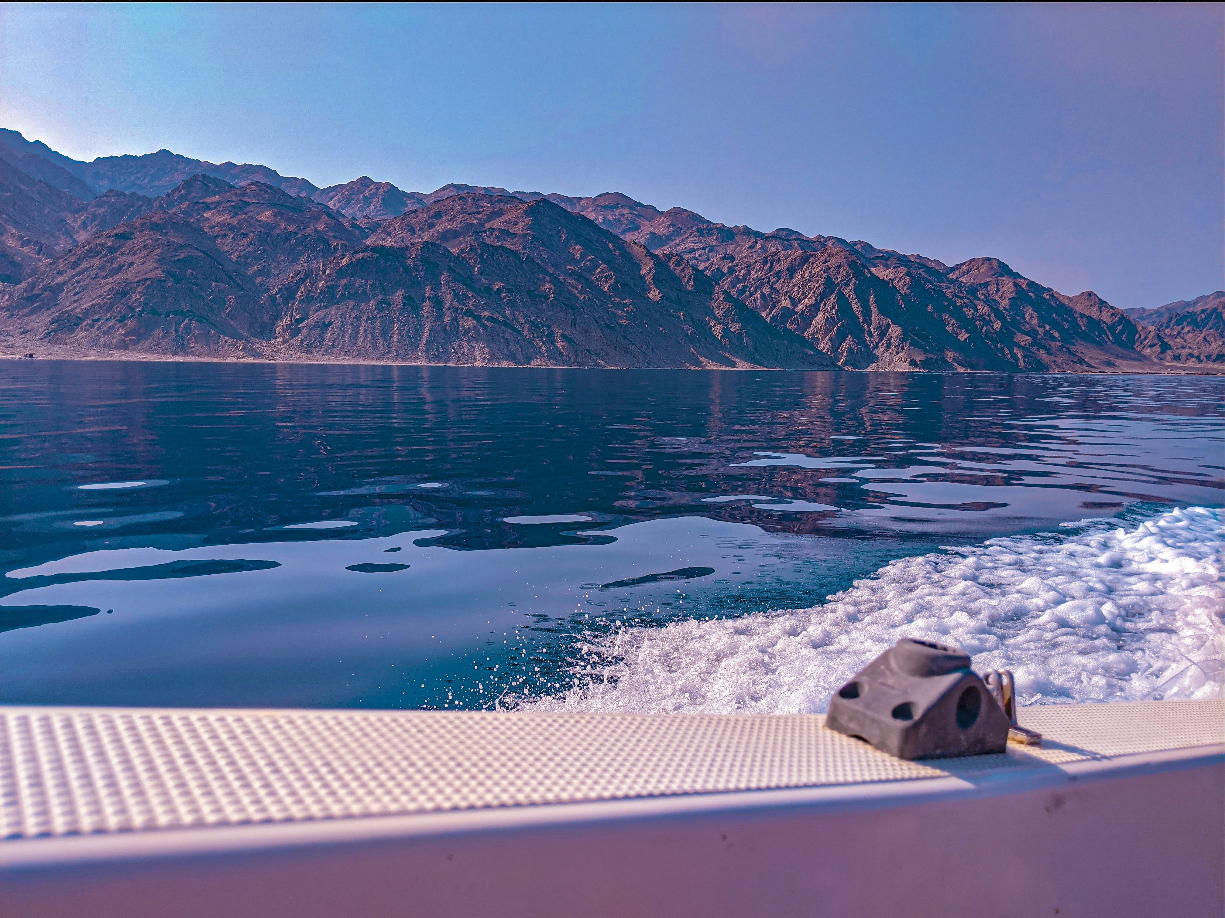 a body of water with mountains in the background, Boat trip Dahab, Egypt Sinai