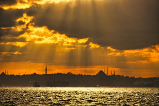 Modern Istanbul skyline with soft warm gold light highlighting key business hubs.