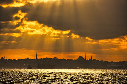 A serene frame capturing golden hour light over Istanbul, with subtle reflections highlighting architectural details.