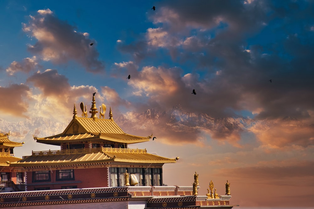 a building with a gold roof and a gold roof with a gold roof