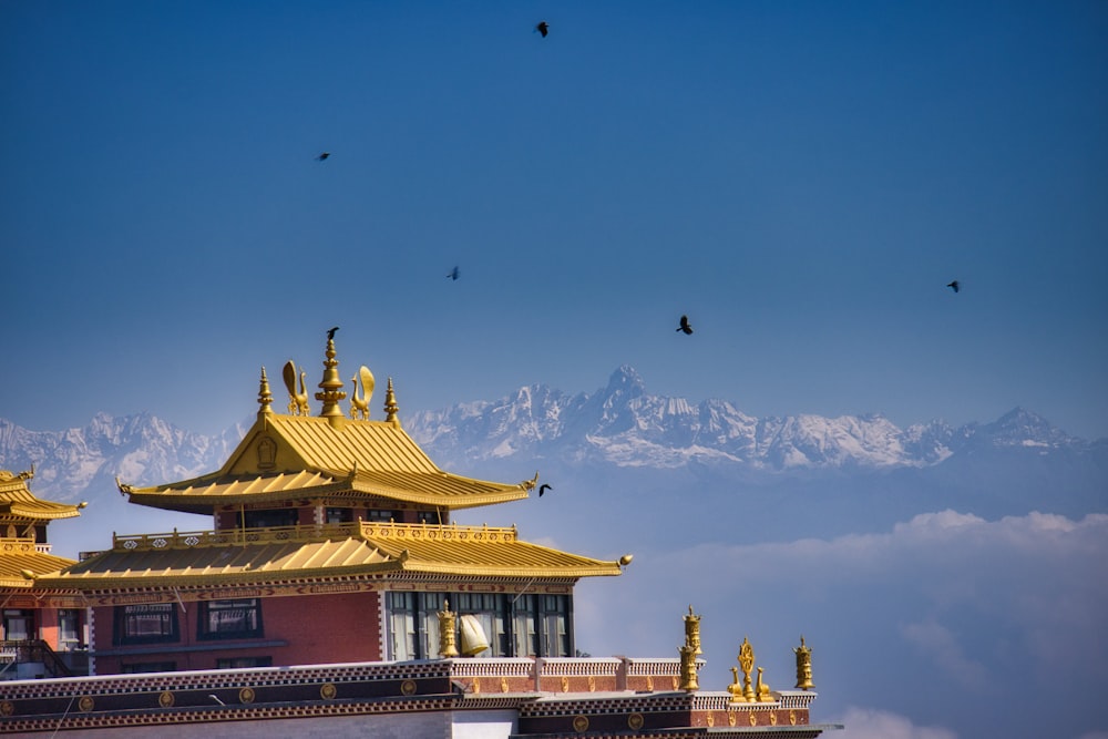 a building with a mountain in the background