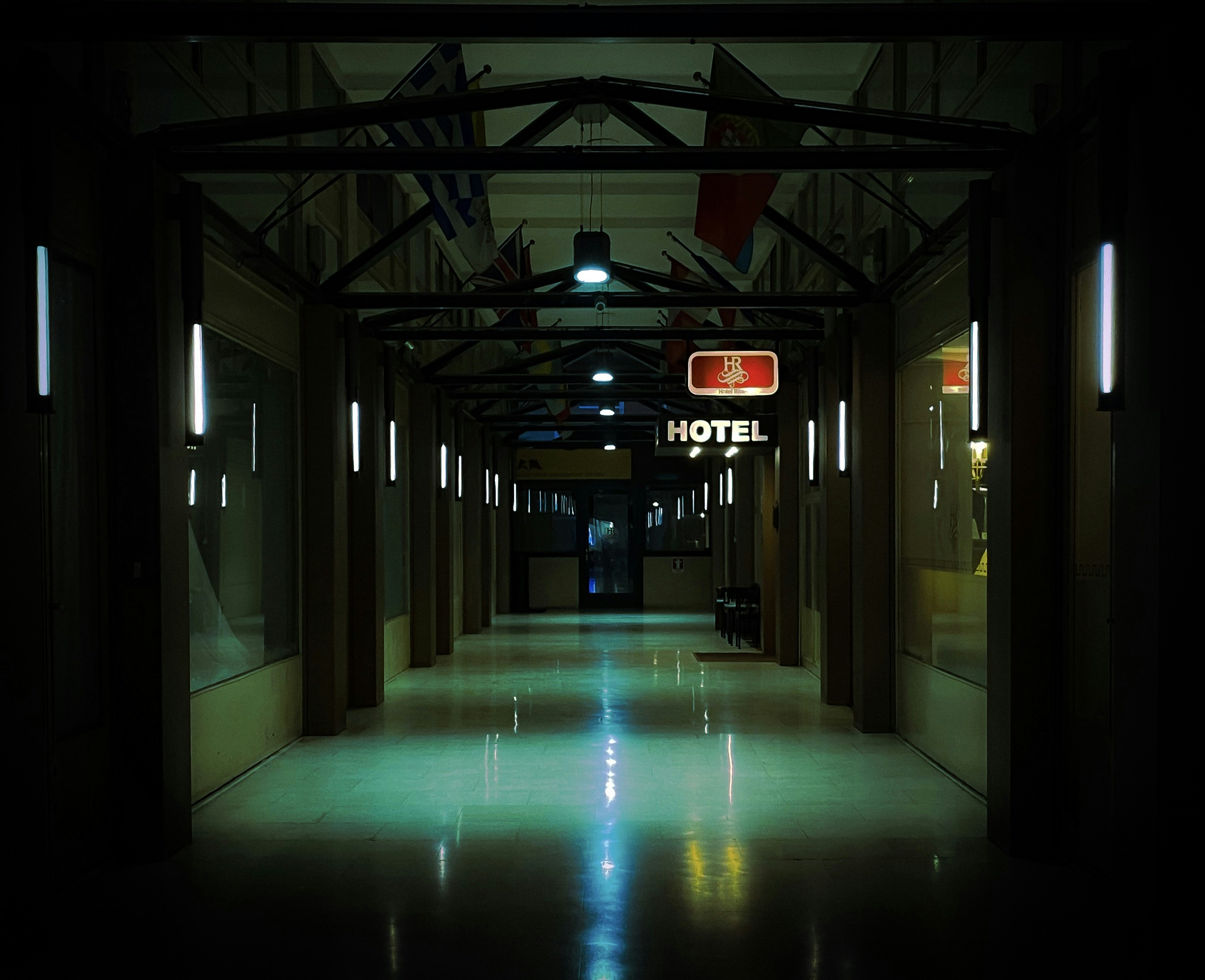 a long hallway with signs, 