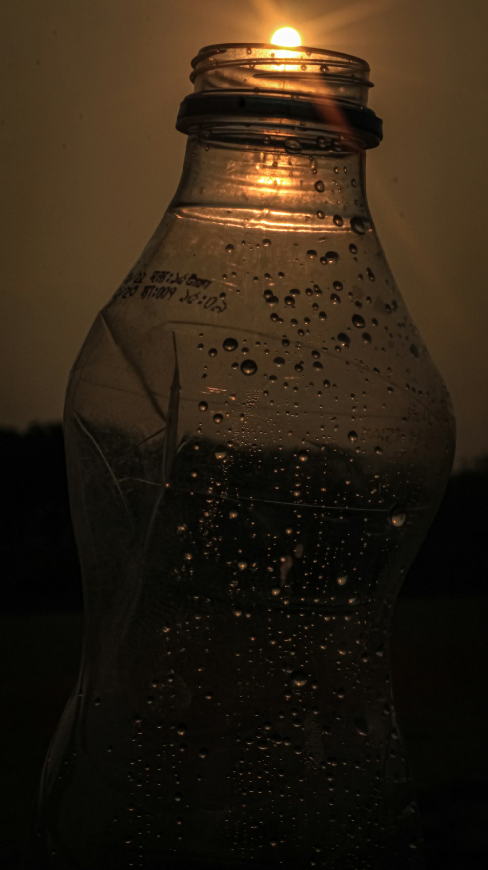 a glass bottle with a light inside