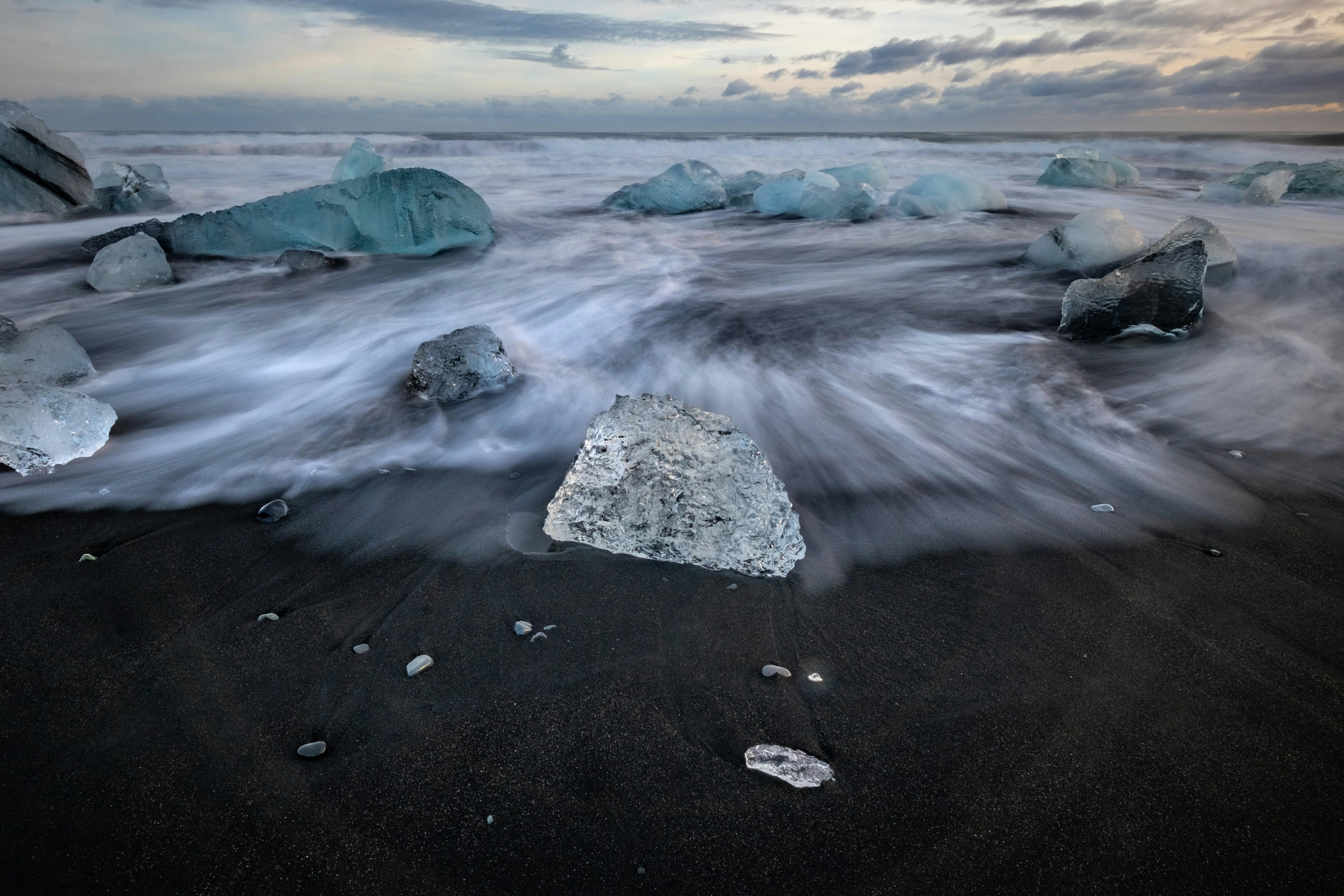a group of icebergs in the water