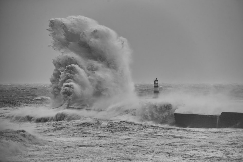 a large wave crashing into a boat